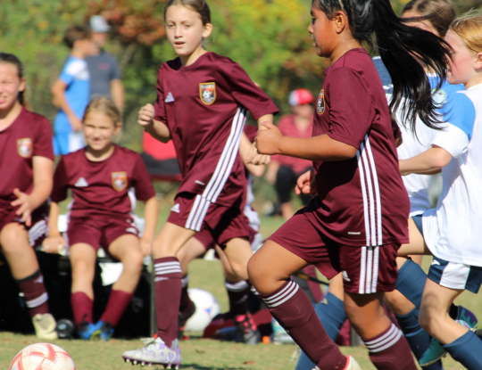 Cleveland Flames youth soccer players competing on a local field in Cleveland, Tennessee